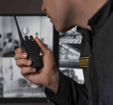 male security guard with-radio station camera screens